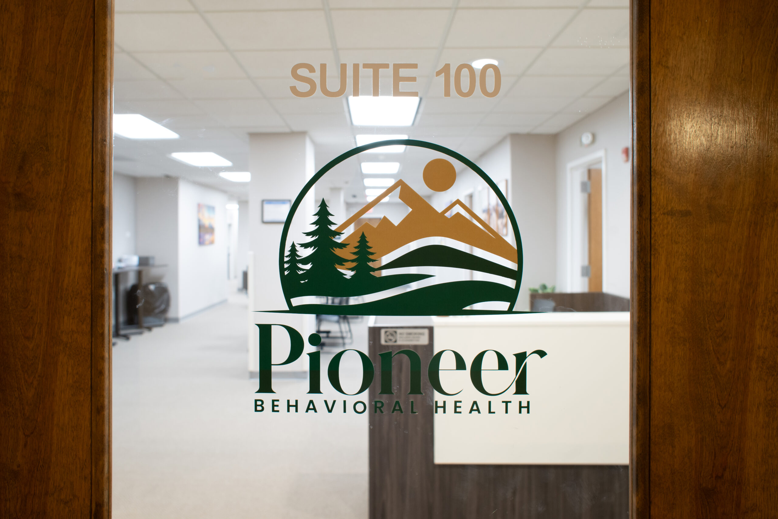 Picture of the suite 100 sign at Pioneer Behavioral Health.