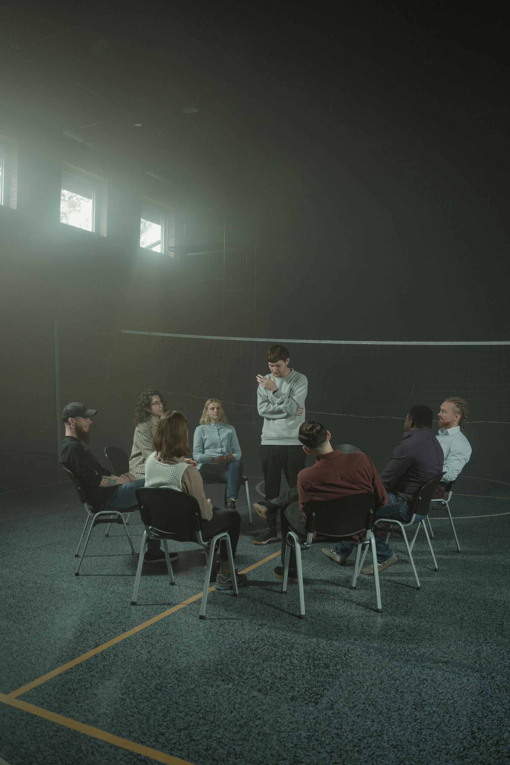 A group of people meeting for group therapy.