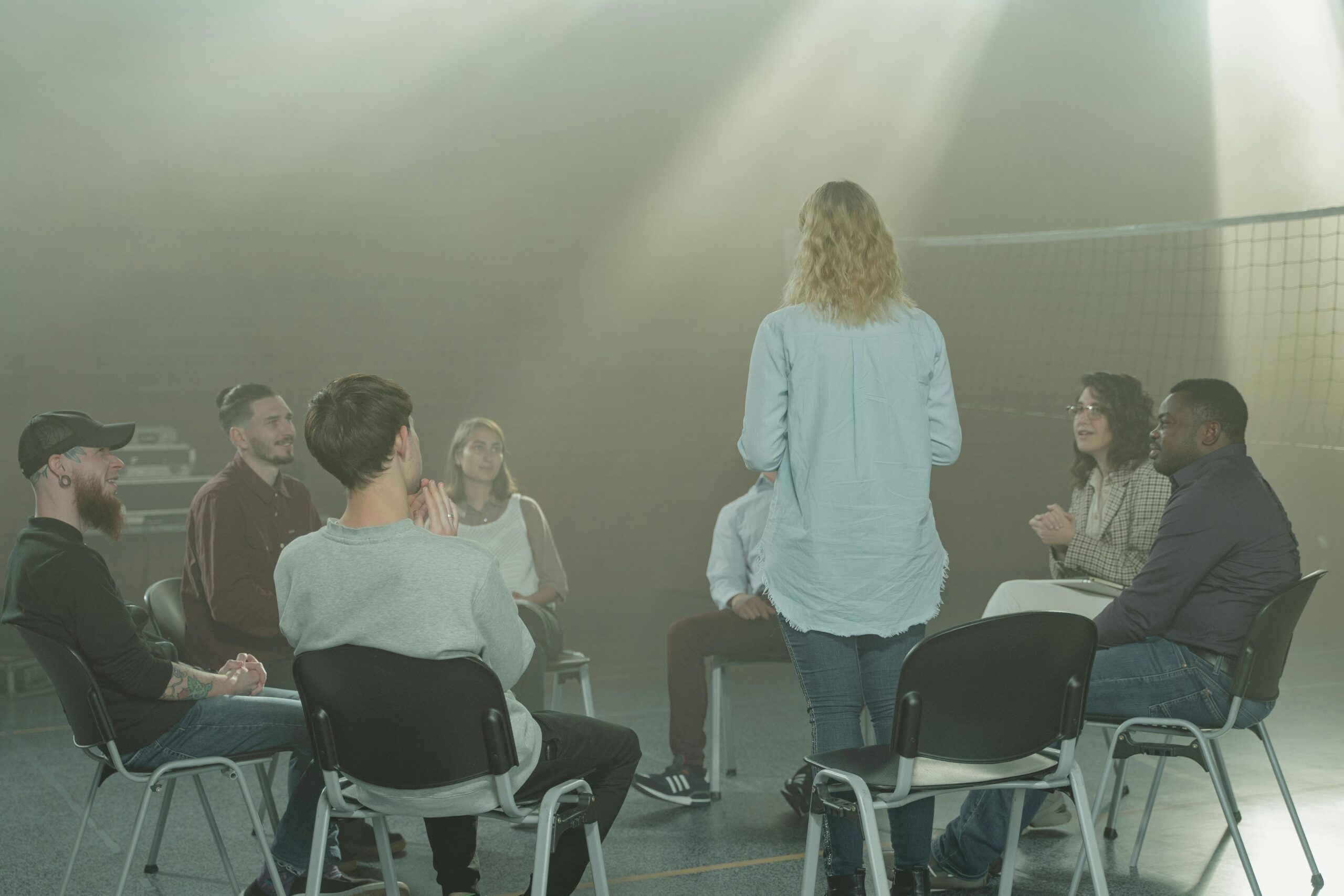 A group therapy session incorporating the 12 steps of recovery.