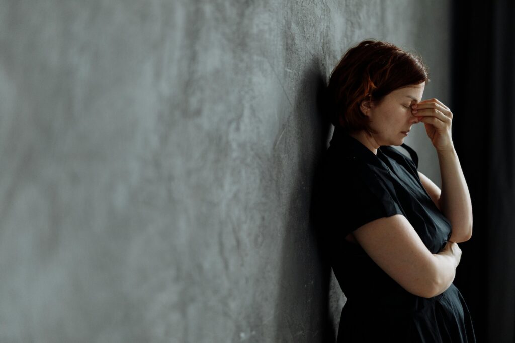 A person managing stress by using stress management techniques.