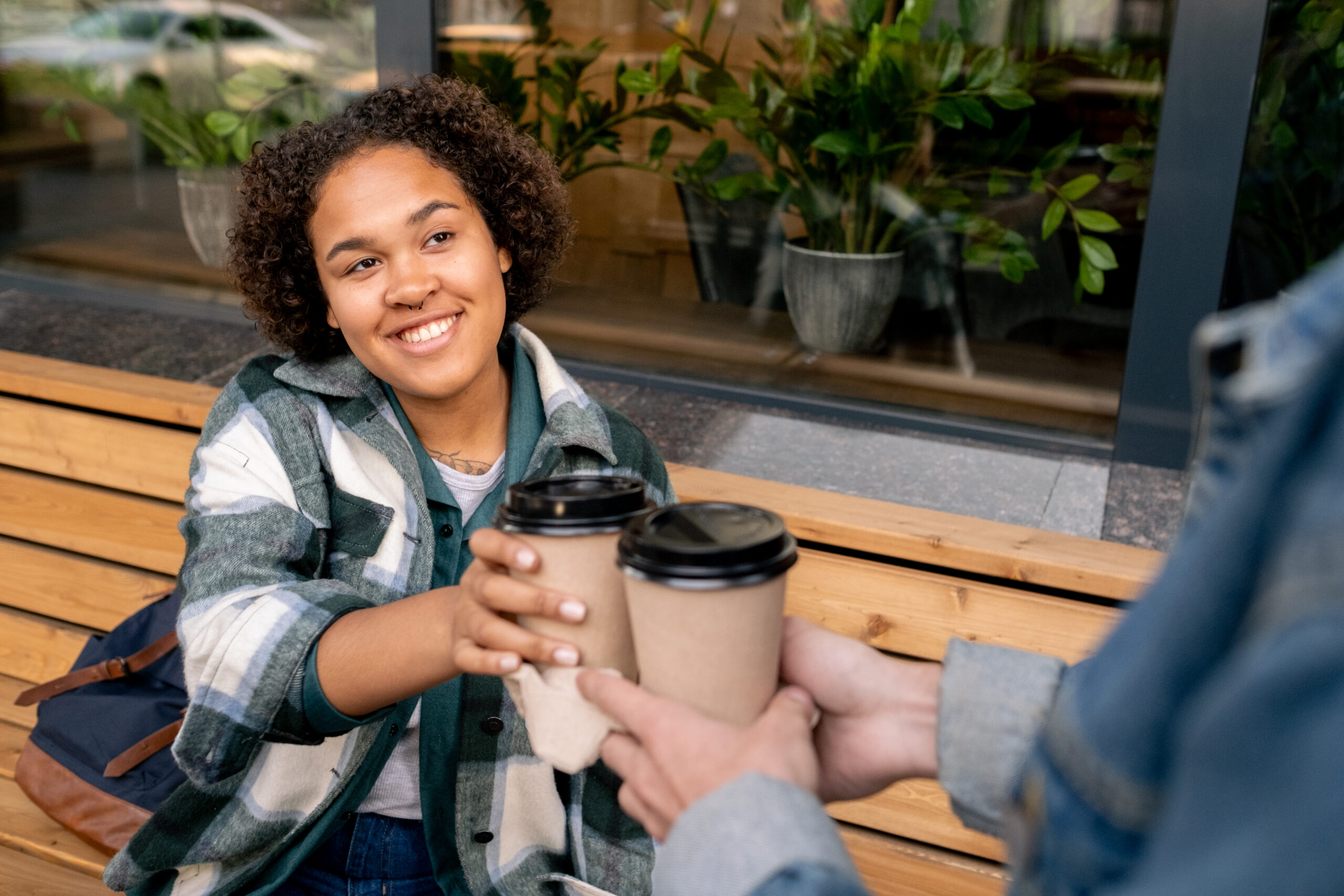 A sponsor in addiction recovery sharing a coffee.