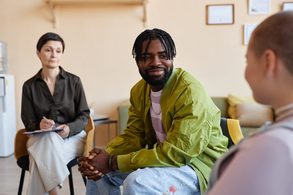 A sponsor in addiction recovery attending a therapy session.