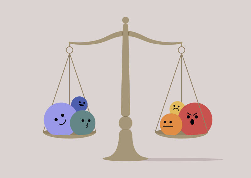 A picture of scales of justice, balancing different emotions.