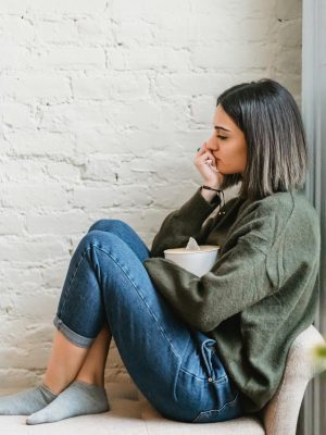 A person managing stress by using stress management techniques.